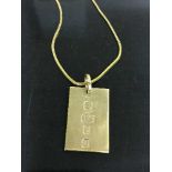 A 9ct gold ingot on 9ct gold chain, 14.3g.