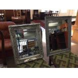 A pair of contemporary silvered framed mirrors