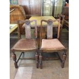 A set of four oak dining chairs