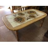 A continental oval oak tiled topped coffee table