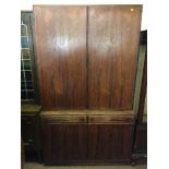 A mid 20th century rosewood double door cabinet