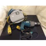 A box of Black & decker hand saw, Makita drill,