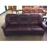 A late 20th century maroon leather three seater settee