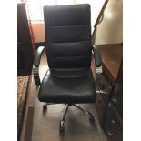 A high back executive swivel office armchair