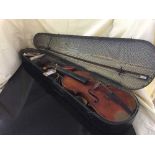 A violin and bow in wooden coffin case bearing paper label Paganini