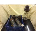 A set of three glass spirit drinks dispensers with brass taps on wooden mounts - Gin,