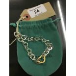 A sterling silver heart bracelet in retail pouch