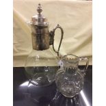 A Victorian style glass claret jug and a 19th century water jug