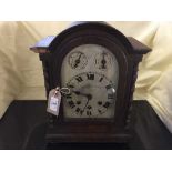 An Edwardian oak Westminster chiming bracket clock with pendulum