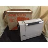 An box Elna Lotus electric sewing machine and a sewing machine kit