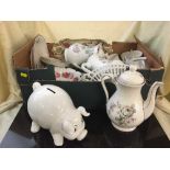 Two boxes of continental dinner ware, piggy bank,