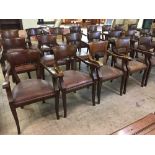 A set of four mahogany pub style armchairs upholstered in brown leather fabric