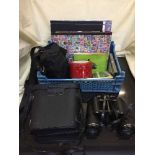 A basket of cased Conquest binoculars, camera in bag,