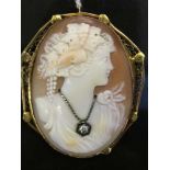 A gold cameo brooch set with a diamond necklace