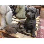 A garden figure - two puppies