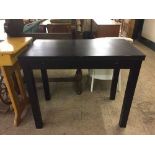 A black ash pull out dining table
