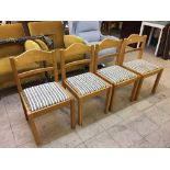 A set of four pine kitchen chairs