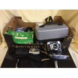 A box of Samsung digital camera, boxed Brownie camera, Helena Paulett camera on stand,