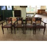 A set of four mahogany pub style armchairs upholstered in brown leather fabric