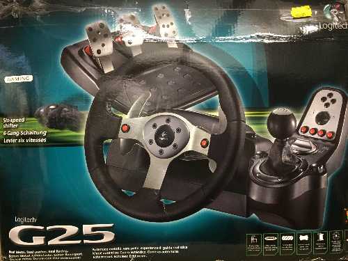 A boxed Logitec G25 steering wheel and foot pedal PC accessory