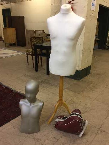 A wooden mannequin on stand, part mannequin,