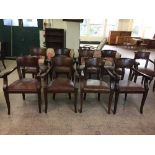 A set of four mahogany pub style armchairs upholstered in brown leather fabric