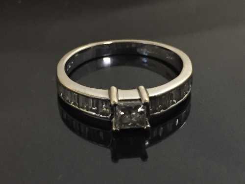 An 18ct white gold and diamond ring,