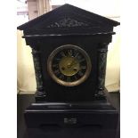 An early 20th century black marble mantel clock