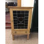 An oak leaded door cabinet