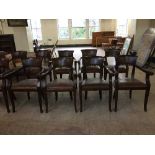 A set of four mahogany pub style armchairs upholstered in brown leather fabric