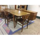 A mid 20th century six piece teak dining room suite