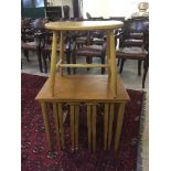 A teak table fitted four beneath and a beech stool