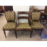 An early 20th century mahogany armchair and a pair of dining chairs