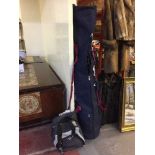 Ski bag with a set of Atomic skis with poles and a pair of Rossignol ski boots in boot bag