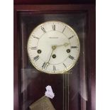 A contemporary mahogany cased German wall clock