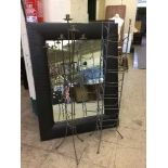 A contemporary leather framed mirror,