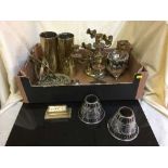 A box of brass shell casings, brass candlesticks,