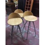 A set of nine contemporary bar stools on chrome legs