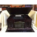 A retro style table top record player and a box of LP records