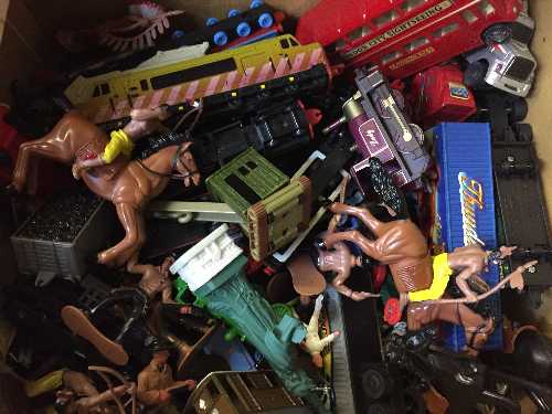 A box of die cast vehicles, plastic soldiers,