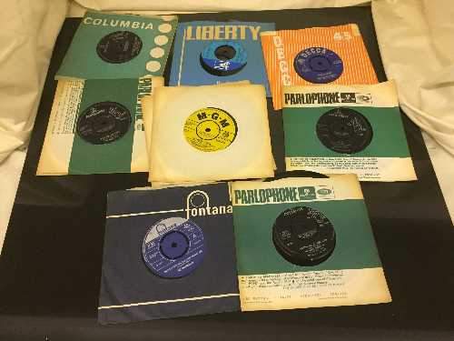 A box of 45's including The Beatles, Rolling Stones, The Who,