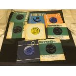 A box of 45's including The Beatles, Rolling Stones, The Who,