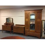 An Edwardian inlaid mahogany three piece bedroom suite