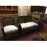 A four piece wicker and bamboo conservatory suite