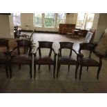 A set of four mahogany pub style armchairs upholstered in brown leather fabric