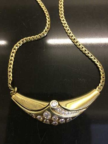 An 18ct gold diamond set necklace, 17.8g.
