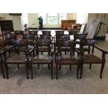 A set of four mahogany pub style armchairs upholstered in brown leather fabric