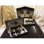 A box of miniature child's tea service, cases of plated table cutlery,