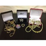 Three boxes of marble beaded necklace, gilt jewellery,