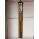 A late 19th century oak stick barometer by Dann of Nottingham